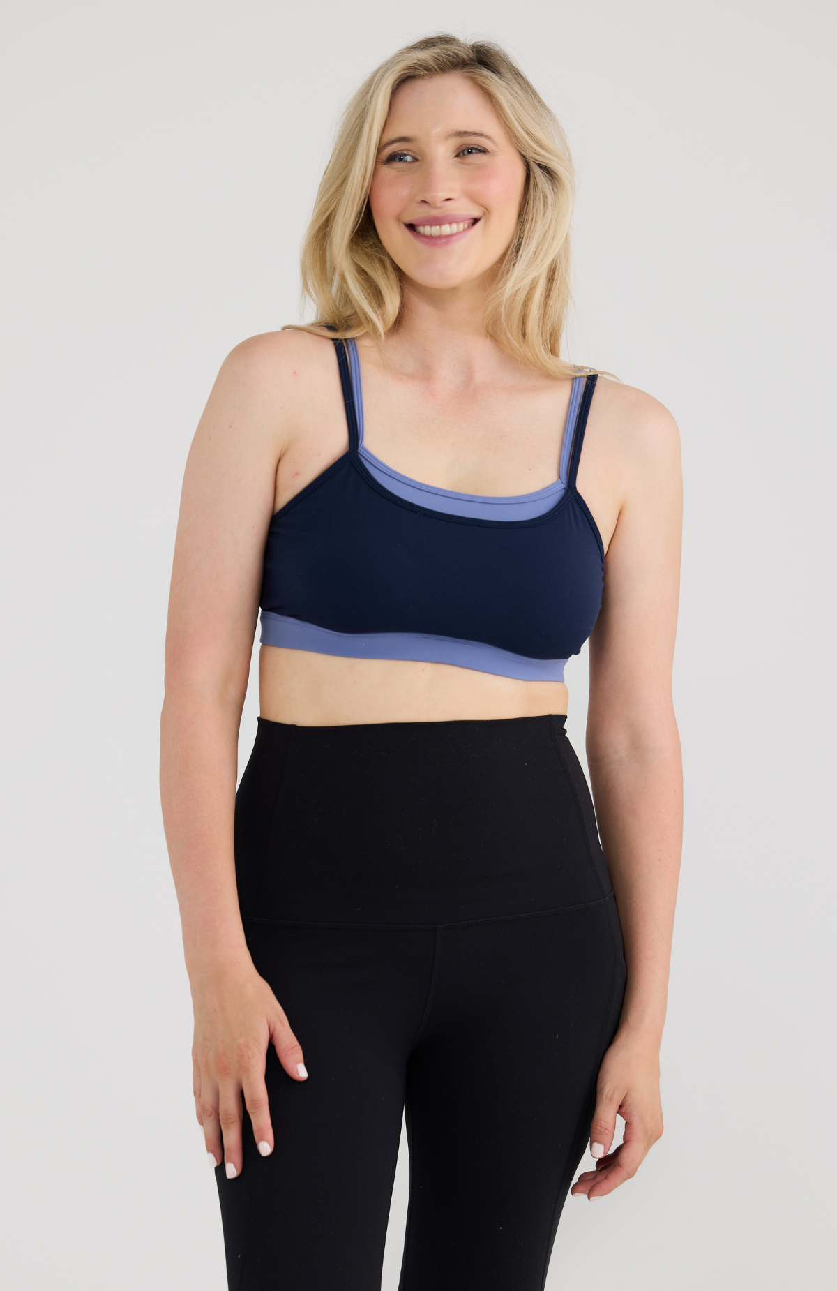 Woman in navy layer bra